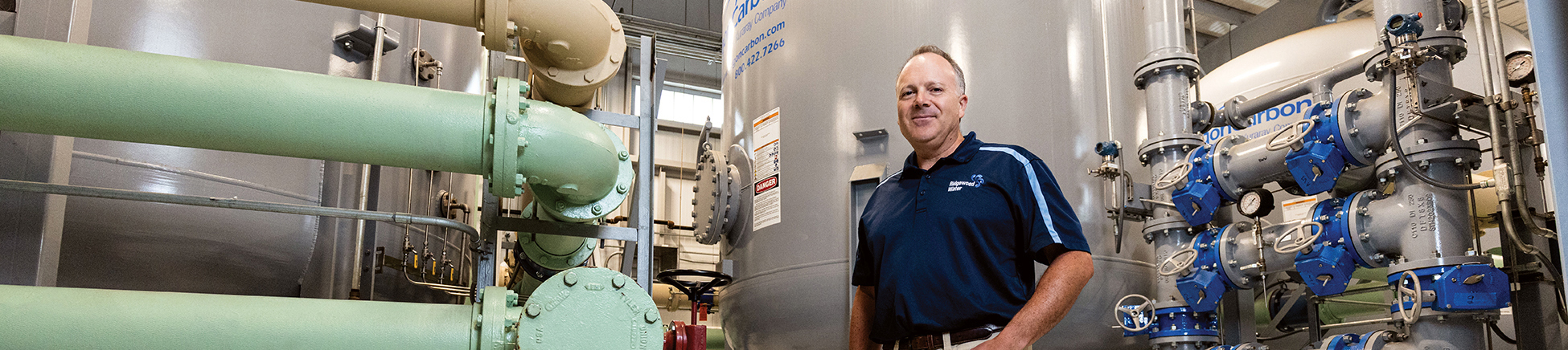 man standing in a water treatment plant