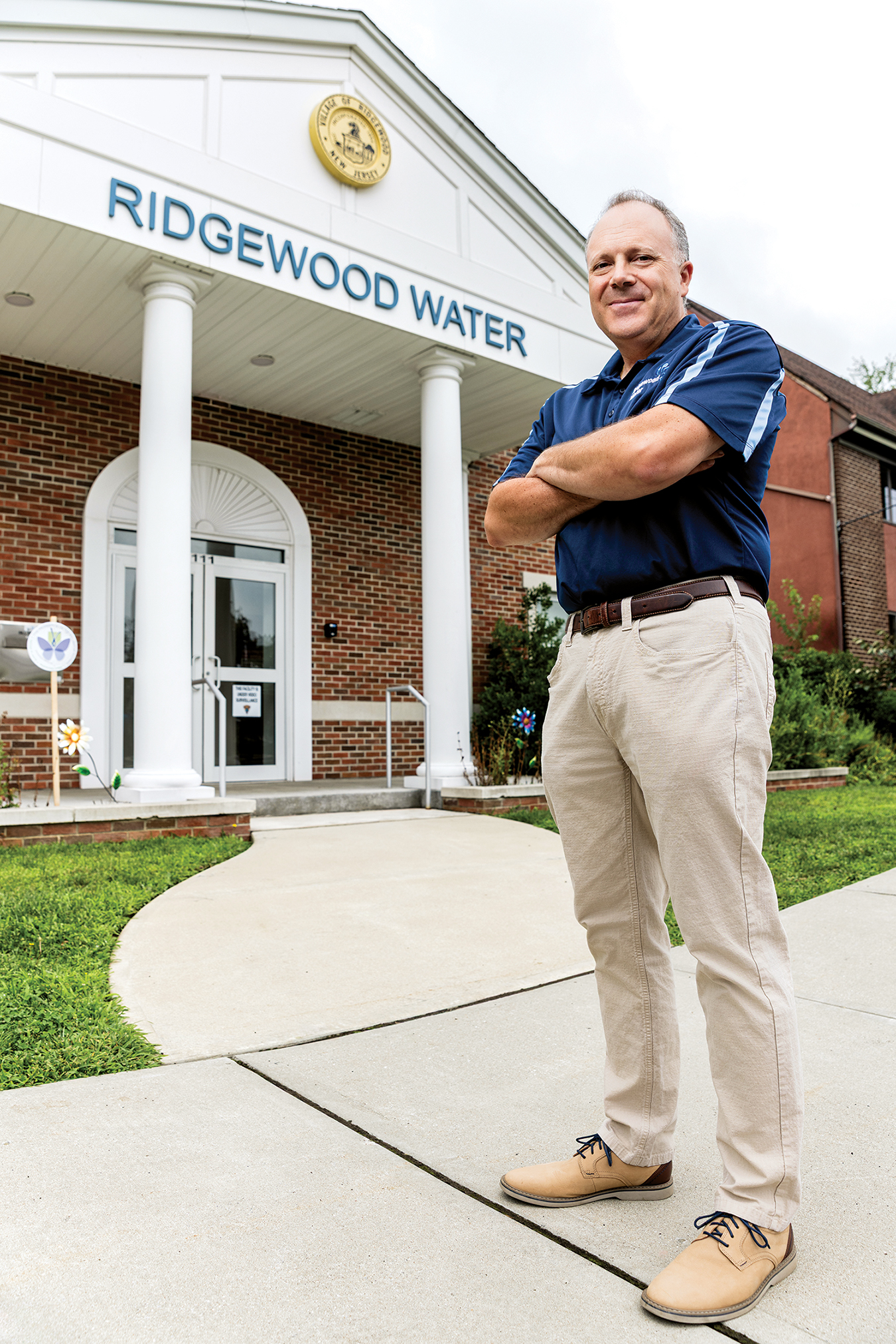 man standing in front of a building