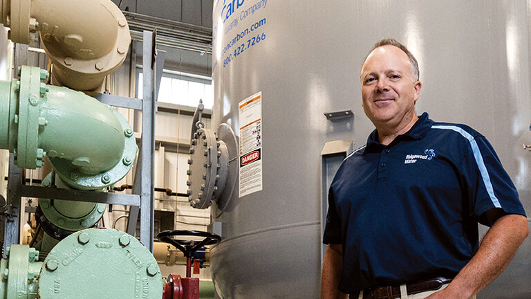 man standing in a water treatment plant