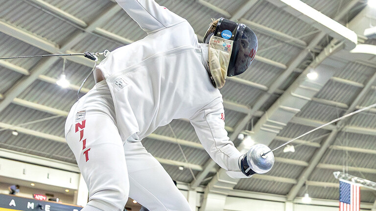 two students fencing