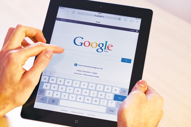 hands holding an iPad